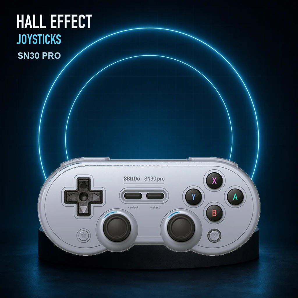 Gray 8BitDo SN30 Pro Hall Effect controller with blue illuminated rings highlighting its dual sticks.
