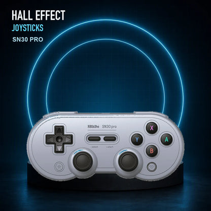 Gray 8BitDo SN30 Pro Hall Effect controller with blue illuminated rings highlighting its dual sticks.