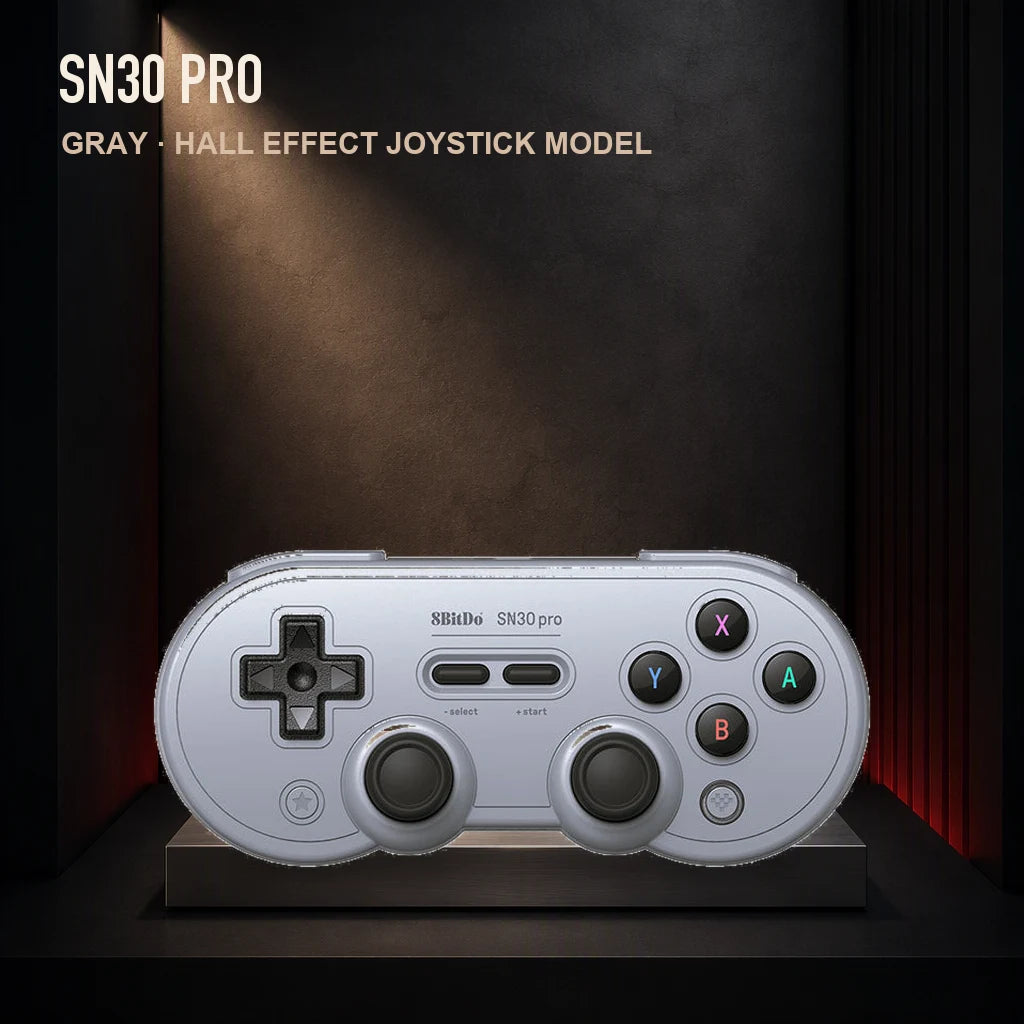 Front view of the gray 8BitDo SN30 Pro Hall Effect controller on a spotlighted display stand.