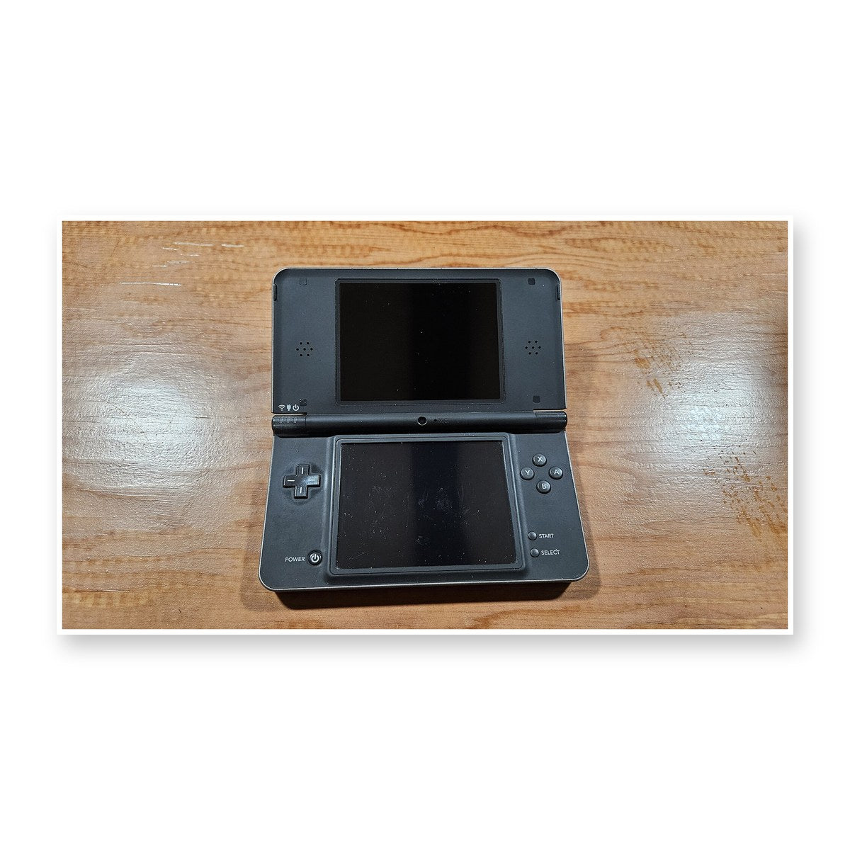 Representative Nintendo DSi XL handheld console, pre-owned