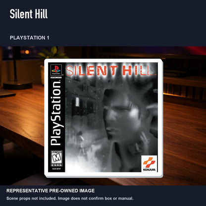 Representative pre-owned Silent Hill (PlayStation 1), product image in a styled desk scene.