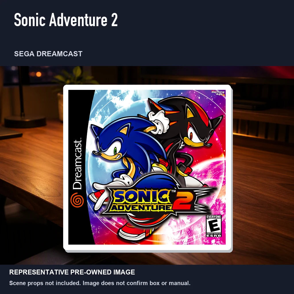 Representative pre-owned Sonic Adventure 2 (Sega Dreamcast), product image in a styled desk scene.
