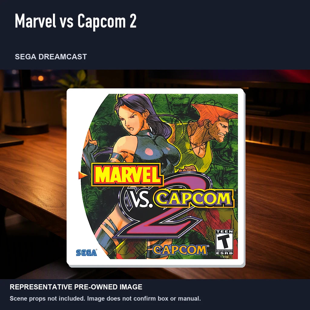 Representative pre-owned Marvel vs Capcom 2 (Sega Dreamcast), product image in a styled desk scene.