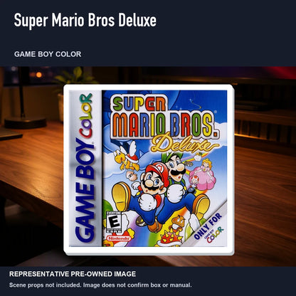 Representative pre-owned Super Mario Bros Deluxe (Game Boy Color), product image in a styled desk scene.