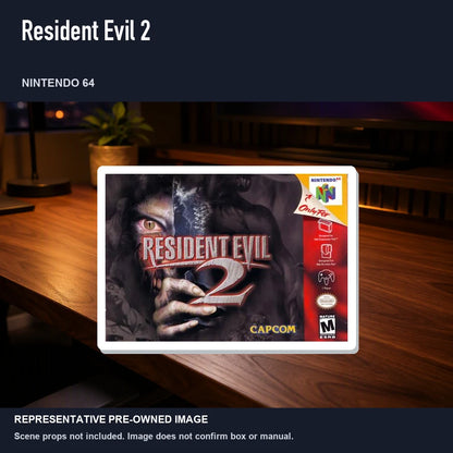 Representative pre-owned Resident Evil 2 (Nintendo 64), product image in a styled desk scene.