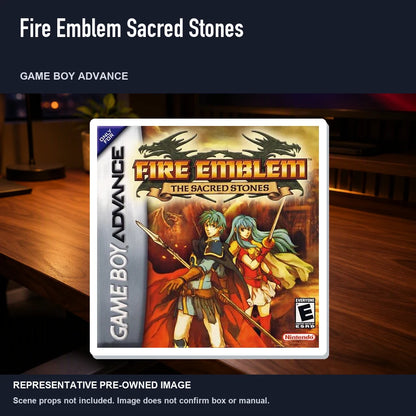 Representative pre-owned Fire Emblem Sacred Stones (Game Boy Advance), product image in a styled desk scene.