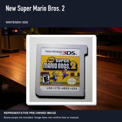 Representative pre-owned New Super Mario Bros. 2 (Nintendo 3DS), product image in a styled desk scene.