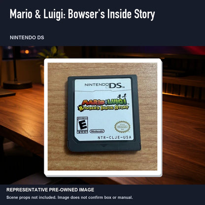 Representative pre-owned Mario & Luigi: Bowser's Inside Story (Nintendo DS), product image in a styled desk scene.