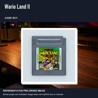 Representative pre-owned Wario Land II (Game Boy), product image in a styled desk scene.