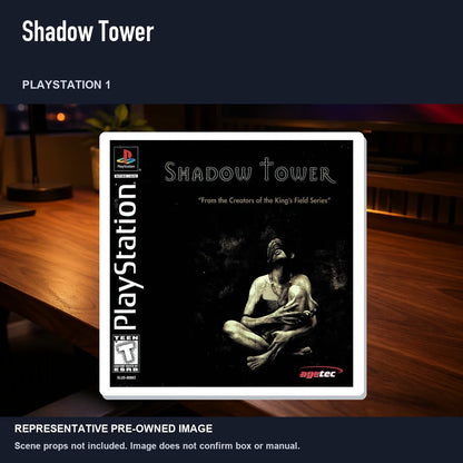 Representative pre-owned Shadow Tower (PlayStation 1), product image in a styled desk scene.