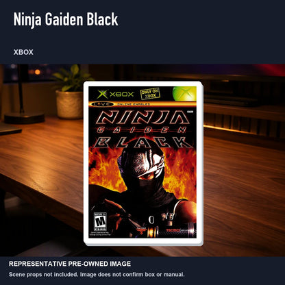 Representative pre-owned Ninja Gaiden Black (Xbox), product image in a styled desk scene.