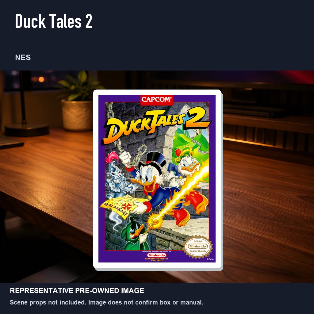 Representative pre-owned Duck Tales 2 (NES), product image in a styled desk scene.