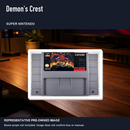 Representative pre-owned Demon's Crest (Super Nintendo), product image in a styled desk scene.