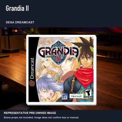 Representative pre-owned Grandia II (Sega Dreamcast), product image in a styled desk scene.