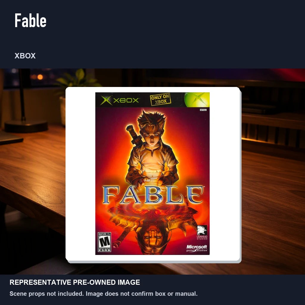 Representative pre-owned Fable (Xbox), product image in a styled desk scene.