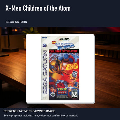 Representative pre-owned X-Men Children of the Atom (Sega Saturn), product image in a styled desk scene.