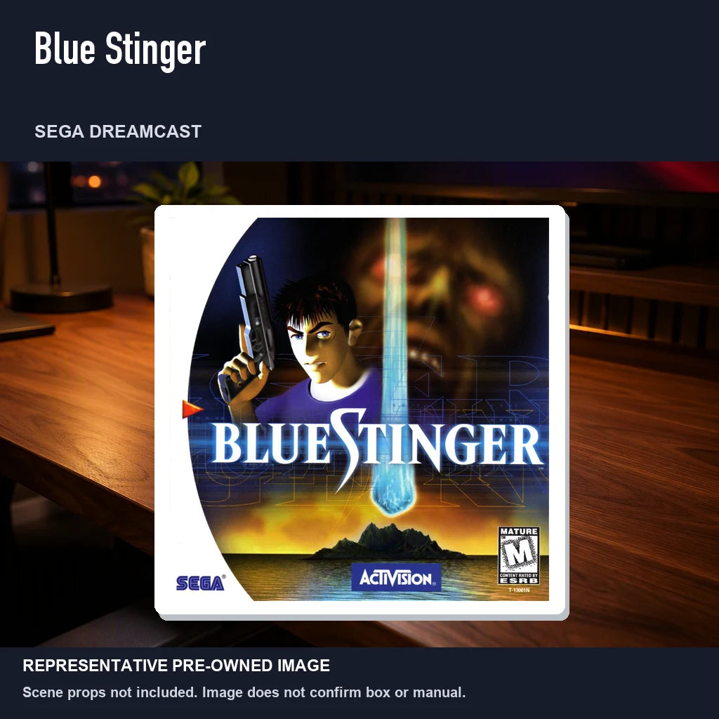 Representative pre-owned Blue Stinger (Sega Dreamcast), product image in a styled desk scene.