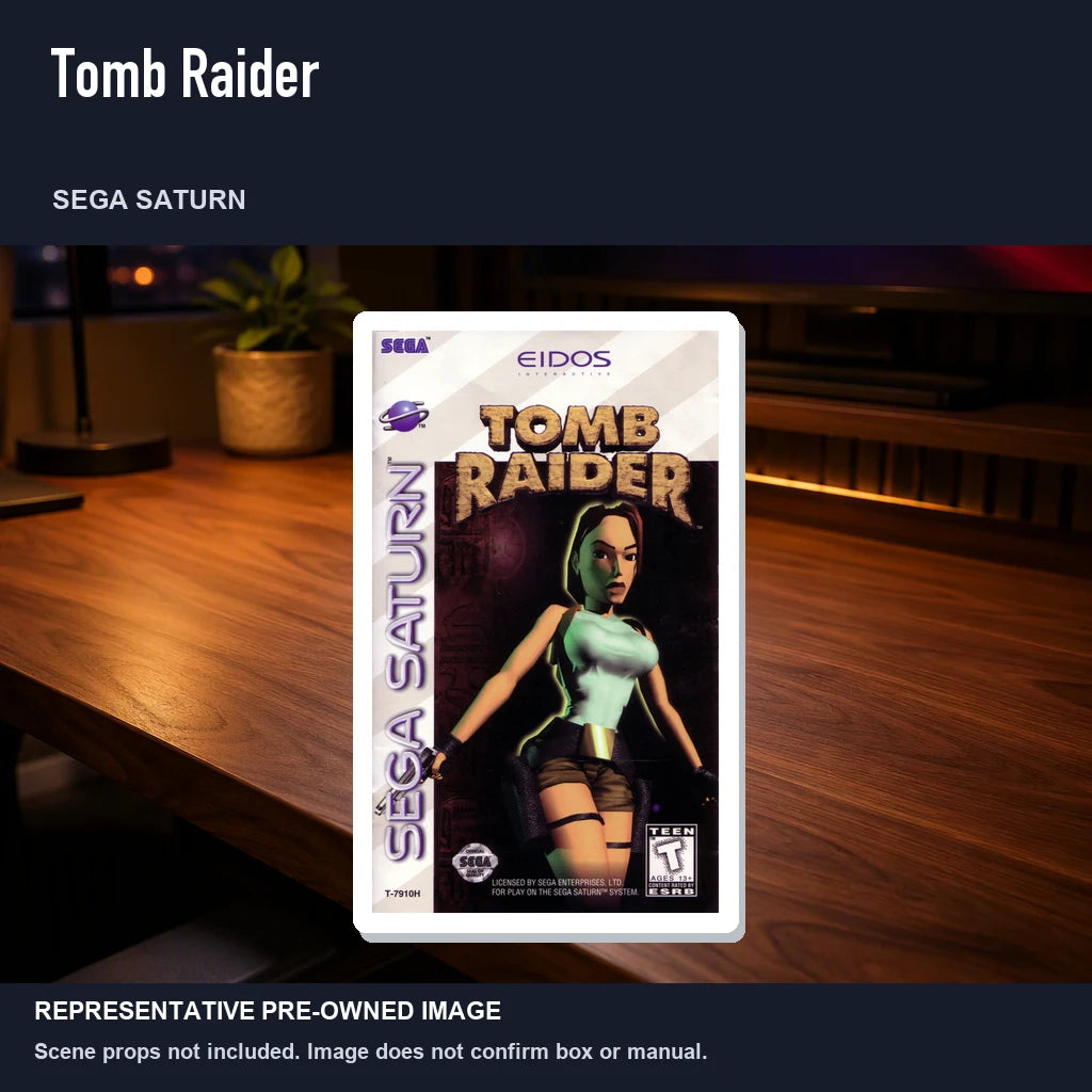 Representative pre-owned Tomb Raider (Sega Saturn), product image in a styled desk scene.
