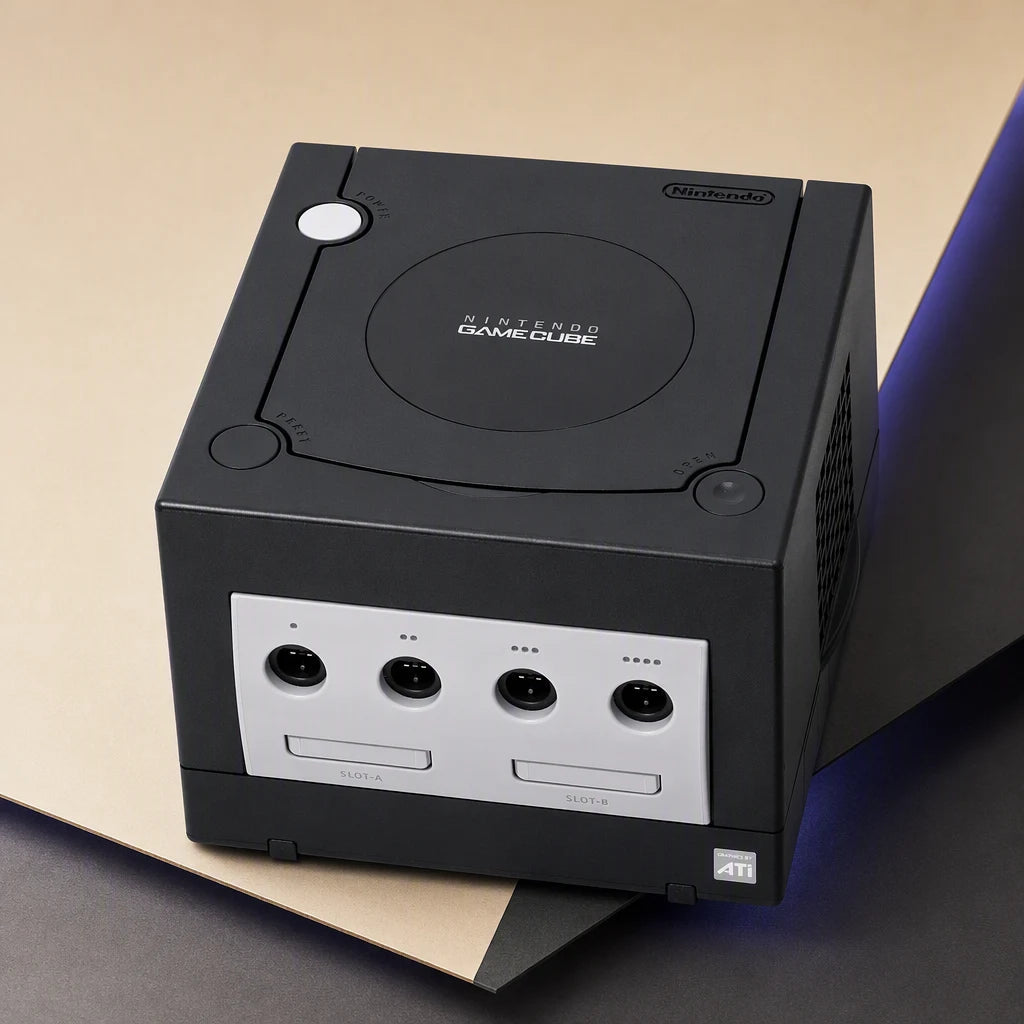 Representative Black Nintendo GameCube system one standalone black Nintendo GameCube console in a cream and charcoal editorial composition, not the specific RGM unit