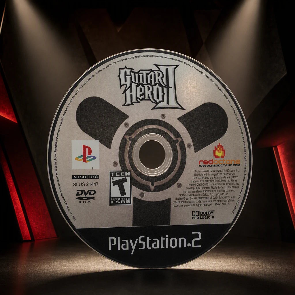 Representative Guitar Hero II one loose black-label North American PlayStation 2 DVD disc displayed alone in a dark museum alcove, not the specific RGM unit