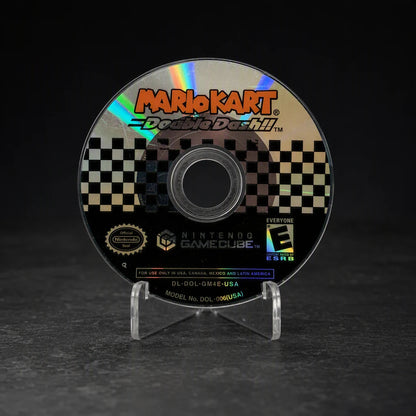 Representative Mario Kart Double Dash Nintendo GameCube game disc in a charcoal collector studio