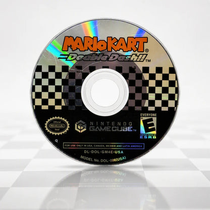 Representative Mario Kart Double Dash Nintendo GameCube game disc in a bright checker-light studio