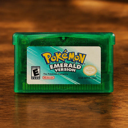 Representative Pokémon Emerald Version for Game Boy Advance on a walnut tabletop
