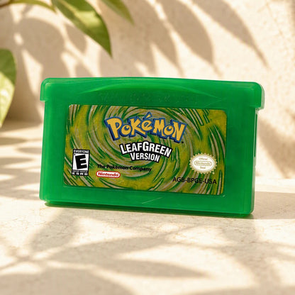 Representative Pokemon LeafGreen Version one loose translucent-green North American Game Boy Advance cartridge on a warm editorial tabletop with shallow depth of field, not the specific RGM unit