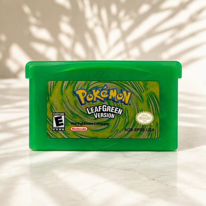 Representative Pokemon LeafGreen Version one loose translucent-green North American Game Boy Advance cartridge under a shaped studio light pattern, not the specific RGM unit
