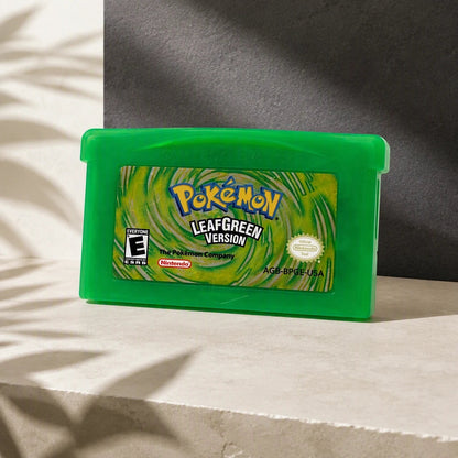 Representative Pokemon LeafGreen Version one loose translucent-green North American Game Boy Advance cartridge in a cream and charcoal editorial composition, not the specific RGM unit