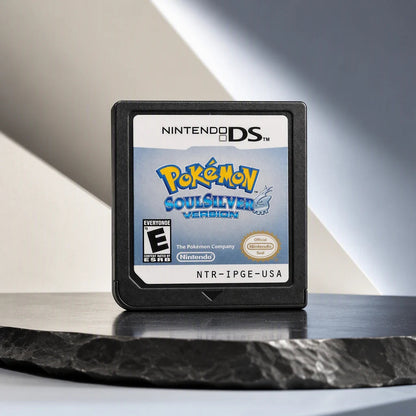Representative Pokemon SoulSilver Version one loose black North American Nintendo DS cartridge in a cream and charcoal editorial composition, not the specific RGM unit