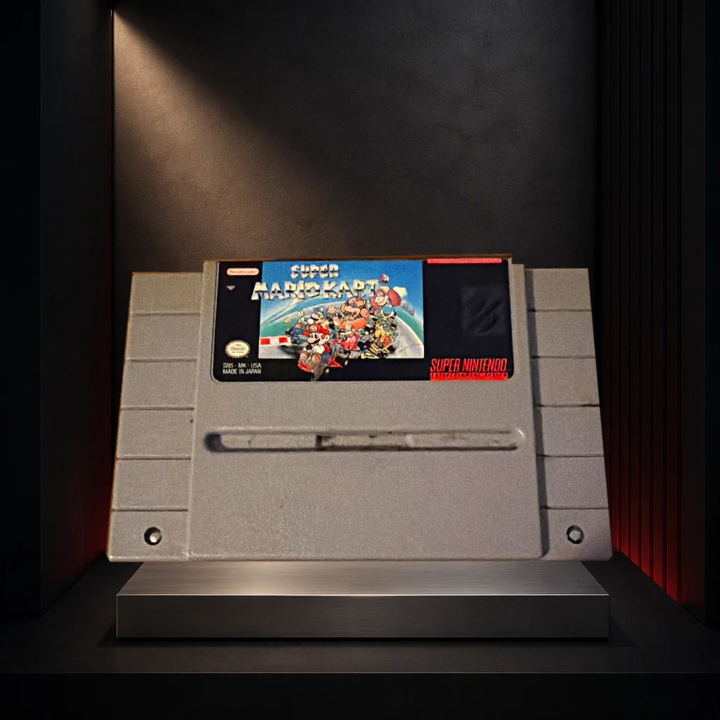 Representative Super Mario Kart loose usa cartridge on a dark collector display plinth, not the specific RGM unit