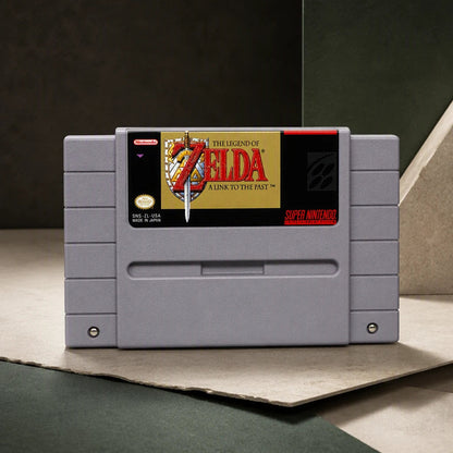 Representative The Legend of Zelda: A Link to the Past one loose gray North American SNES cartridge in a cream and charcoal editorial composition, not the specific RGM unit